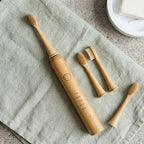 kabu toothbrush with bamboo brush heads on sage linen