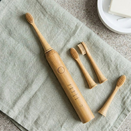 kabu toothbrush with bamboo brush heads on sage linen